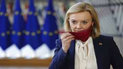 British Foreign Secretary Liz Truss arrives for an extraordinary EU foreign ministers meeting at the European Council building in Brussels.