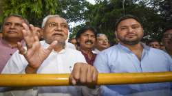 Janata Dal (United) leader Nitish Kumar with Rashtriya Janata Dal leader Tejashwi Yadav interacts with the media after meeting Bihar Governor Phagu Chauhan, in Patna, Tuesday, Aug. 9, 2022.