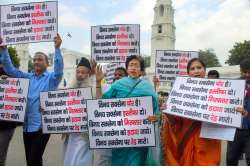 New Delhi: AAP MLAs display placards during a protest against Lt Governor Vinai Saxena at the State Assembly, in New Delhi