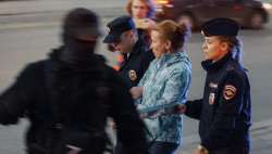 Police detain a demonstrator during a protest against mobilization in Yekaterinburg, Russia, Wednesday, Sept. 21, 2022.