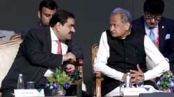 Rajasthan chief minister Ashok Gehlot interacts with Adani Group chairman Gautam Adani at the two-day Invest Rajasthan Summit 2022 in Jaipur.