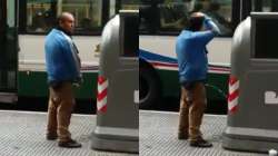 Bizarre! Man applies urine to hair in open street