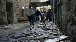 Palestinians gather at the site where Israeli forces destroyed an explosive lab belonging an armed group calling itself the Lions' Den, in the occupied West Bank city of Nablus, Tuesday, Oct. 25, 2022. 