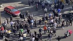 In this frame grab from video taken by an individual not employed by the Associated Press and obtained by the AP outside Iran shows people block an intersection during a protest. 