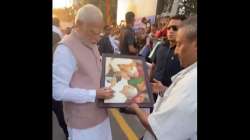 PM Modi gets down from his car to accept greetings from people in Jamnagar.