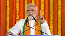 Prime Minister Narendra Modi addresses during the launch of development initiatives in Amod, Gujarat, on Monday.