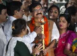 Shiv Sena (Uddhav Balasaheb Thackeray) leader Sanjay Raut celebrates on his arrival at his residence following his release from Arthur Road Jail, in Mumbai