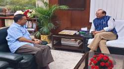 Delhi Lt Governor Vinai Kumar Saxena interacts with Chief Minister Arvind Kejriwal during a meeting. (File photo)