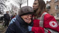 A woman cries in front of the building which was destroyed by a Russian attack in Kryvyi Rih.