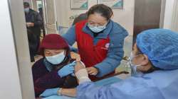 An elderly woman gets vaccinated against COVID-19 at a community health centre in Nantong in eastern China's Jiangsu province.