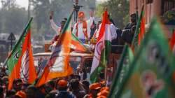 BJP National President JP Nadda waves at supporters during a roadshow in Ahmedabad, Gujarat.