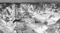 In this drone image, snow blankets a neighborhood, Sunday, Dec. 25, 2022, in Cheektowaga, N.Y.