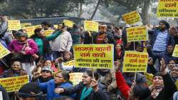 AAP activists raise slogans during a protest against BJP, near BJP headquarters in New Delhi.