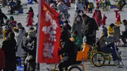 Residents enjoy skating on the crowded frozen Houhai Lake in Beijing.