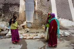 Water oozes out after cracks appeared in the houses due to landslides at Joshimath.