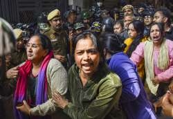 Locals protesting DDA's action in Delhi's Mehrauli.