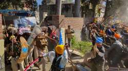 Followers of Waris Punjab De founder Amritpal Singh clash with the police while breaking through barricades at the police