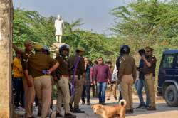 Prayagraj: Policemen on the spot where Arbaaz, suspect in Umesh Pals killing, was killed in an encounter, in Prayagraj. Umesh Pal was the key witness in the former BSP MLA Raju Pal's murder case in which Atiq Ahmed is an accused.