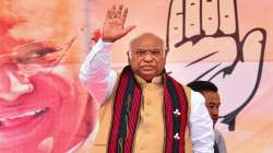 Congress President Mallikarjun Kharge waves at supporters as he arrives to address an election rally ahead of Nagaland Assembly election, at Diphupar Village, Chumukedima.