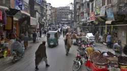 People visit a market in the old area of Peshawar, Pakistan.