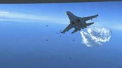 A Russian Su-27 approaches the back of the MQ-9 drone and begins to release fuel as it passes, over the Black Sea.