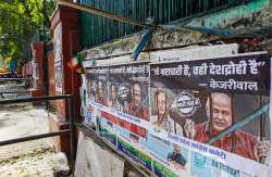 Posters of AAP leaders Manish Sisodia and Satyendar Jain put up