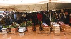 People attend the burial ceremony of some of the people who lost their lives following heavy rains caused by Cyclone Freddy in Blantyre, southern Malawi.