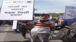 A bike taxi driver agitating against the Delhi government.