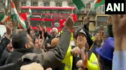 British policeman dances with Indian supporters outside the Indian High Commission in London.