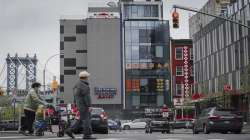 A six-story glass facade building, centre, is believed to be the site of a foreign police outpost for China in New York's Chinatown.