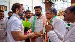 Congress leader Rahul Gandhi being received by party leader Jagadish Shettar upon his arrival in Hubballi.