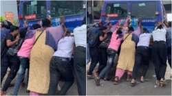 Passengers come together to push stalled bus 