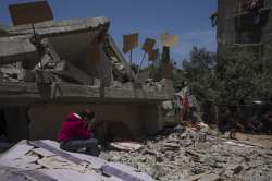 Smoke and fire rise from an explosion caused by an Israeli airstrike targeting a building in Gaza