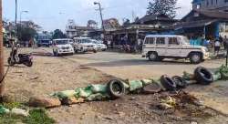 A road wears a partially deserted look after a fresh violence, in Kangkopki district of Manipur