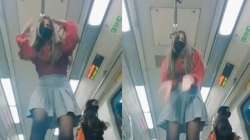 girl dancing inside Delhi Metro