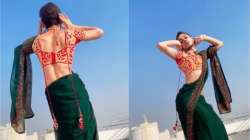 Man wearing saree dances to Sharara