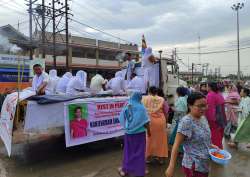 People attend the funeral procession of the nine civilians who were killed in the Tuesday nights violence