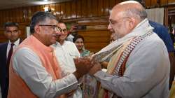 Union Home Minister Amit Shah being welcomed by BJP MP Ravishankar Prasad on his arrival at the Jai Prakash Narayan Airport in Patna