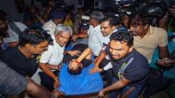 Tamil Nadu Electricity Minister V Senthil Balaji reacts in pain while being taken to a government hospital after his arrest in connection with a money laundering case, in Chennai.