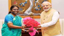 PM Narendra Modi with President Murmu at her official residence in Delhi.