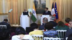 PM Modi and French President Emmanuel Macron attend a joint press conference at the Elysee Palace in Paris