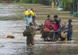 People from low-lying areas around the Yamuna river are relocating to a safer place as water level reaches all-time high.