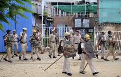 Gurugram: Police personnel outside Anjuman Mosque which was set ablaze in the Sector 57 area, in Gurugram district