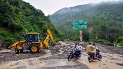 An earthmover carries out restoration work as debris accumulated at the Dehradun Maldevta Chowk following heavy rainfall, in Dehradun. (Representational image )