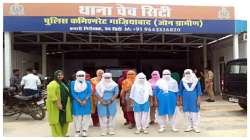  School girls outside the police station 
