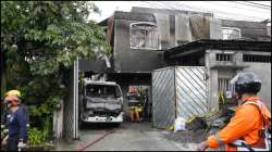 Firefighters at a Philippine factory in Quezon City, where a fire claimed 15 lives.