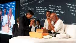 British PM Rishi Sunak greeting Morari Bapu at the Ram Katha in Cambridge University