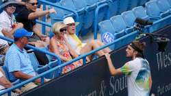 Stefanos Tsitsipas interacts with the crowd during his match against Ben Shelton in Cincinnati Maste