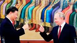 Russian President Vladimir Putin, right, and Chinese President Xi Jinping toast during their dinner.