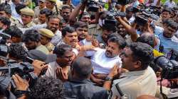 Police personnel detain Telangana Congress president A Revanth Reddy during a protest, in Hyderabad.